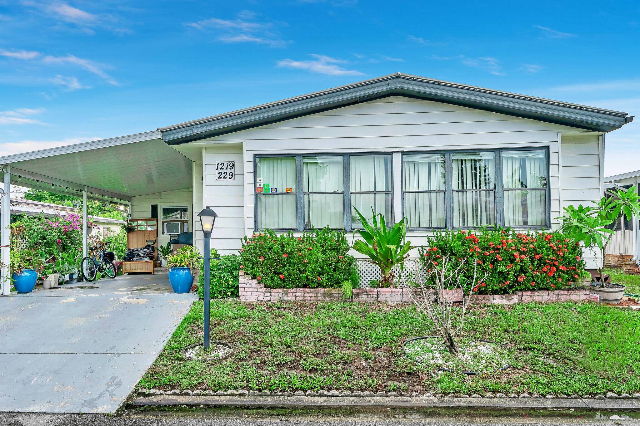 Nicely taken care of manufactured home with 3 2 and ample space in the Palm Beach Colony.