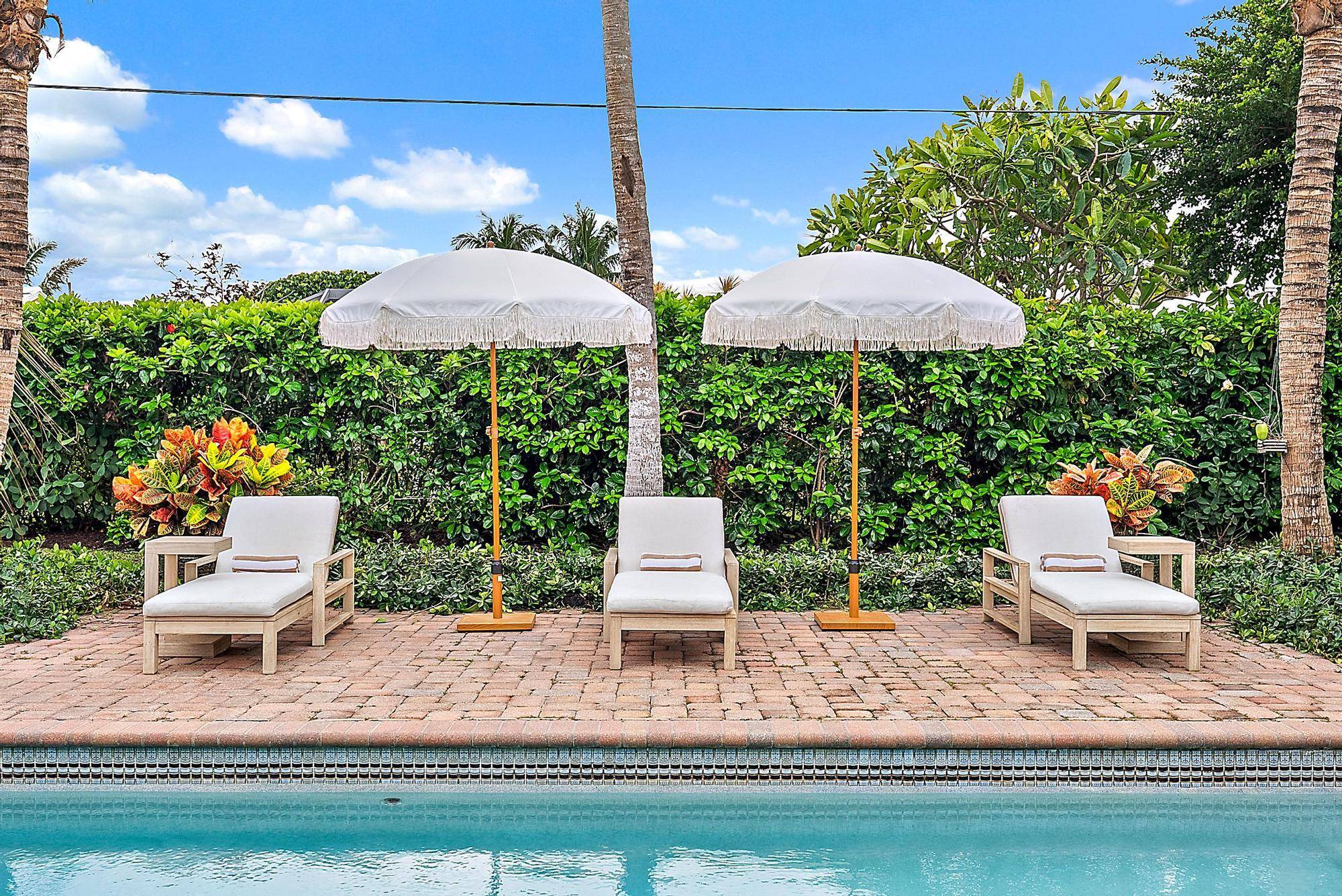 ''BACK ON THE MARKET DUE TO BUYERS LOAN COMMITMENT NOT RECEIVED''Experience coastal elegance at 1151 Emerald Lane, Singer Island.