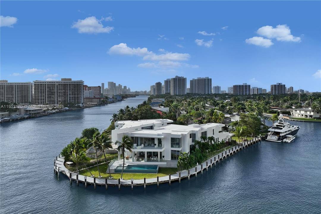 Welcome to this brand new architectural gem located in the exclusive guard gated waterfront community of Golden Isles in Hallandale Beach.