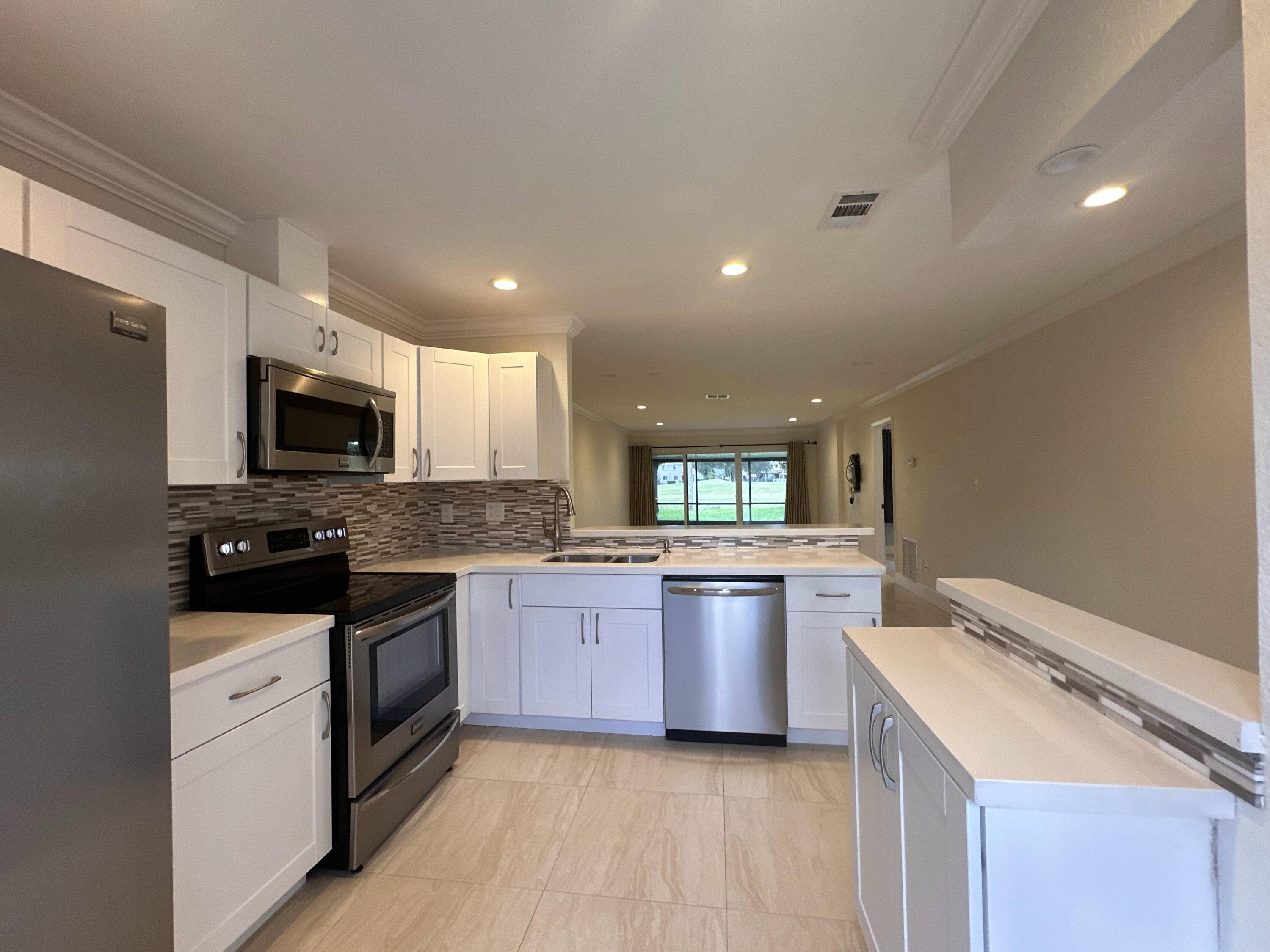 Welcome home to a Beautifully remodeled, 2 bedroom, 2 bath single family villa nestled along sidetone the Colony West Golf Course in Tamarac.