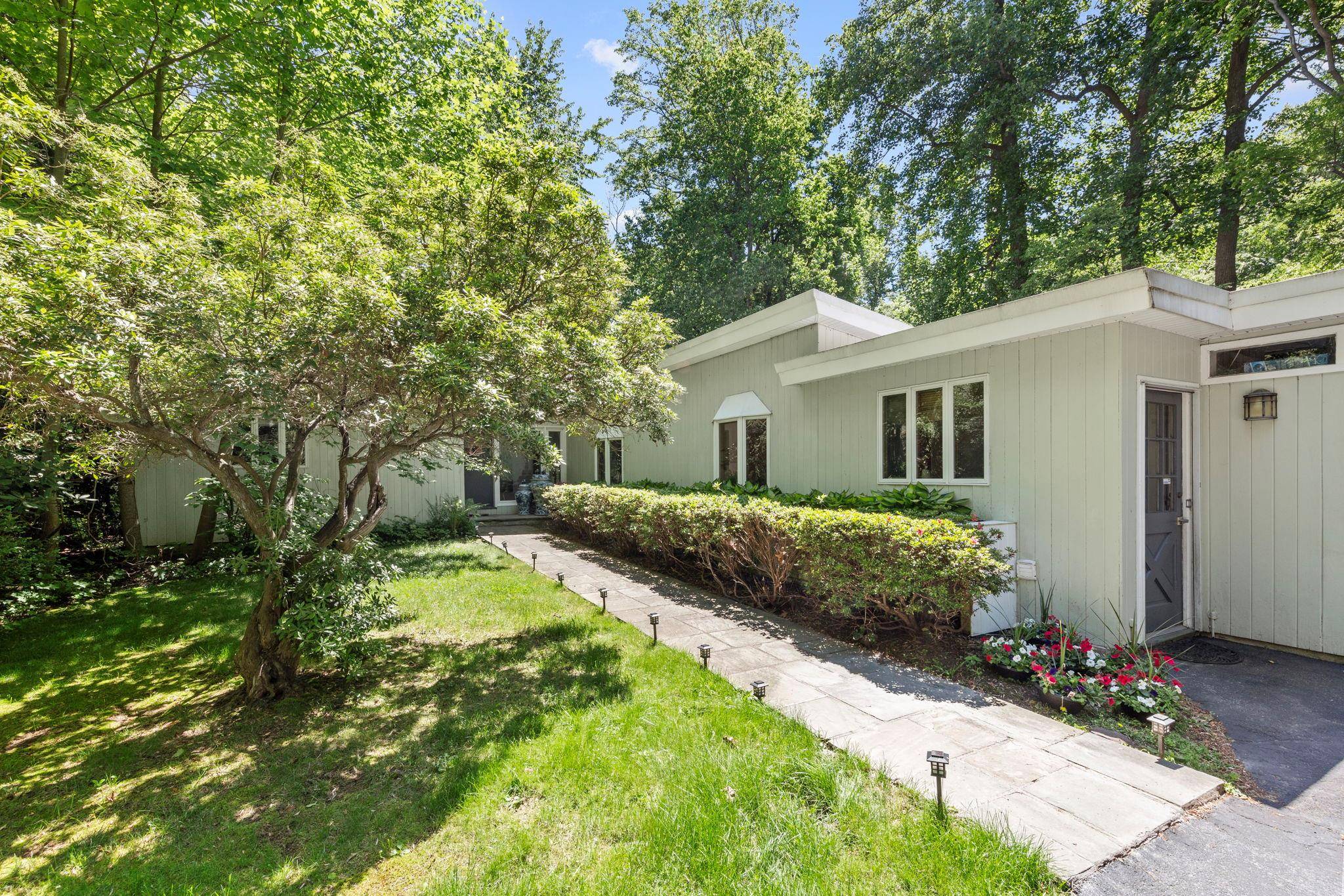 Presenting this charming Mid Century Modern ranch on one of the best streets of Lloyd harbor Village !