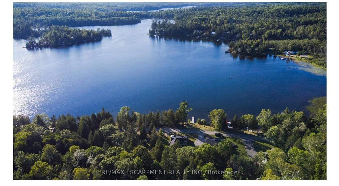 Rare Lakefront Offering Featuring Two Fully Renovated Detached Cottages on 1.