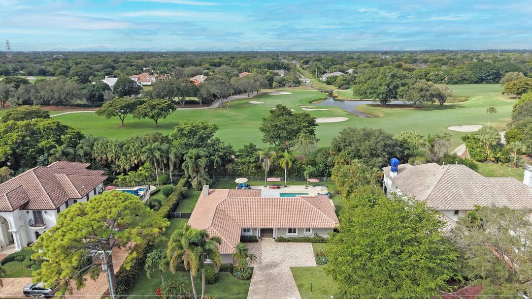 Situated on a nearly half acre, fully fenced lot in a quiet section of Pine Tree Country Club Estates, this residence combines privacy, thoughtful upgrades, and striking curb appeal.