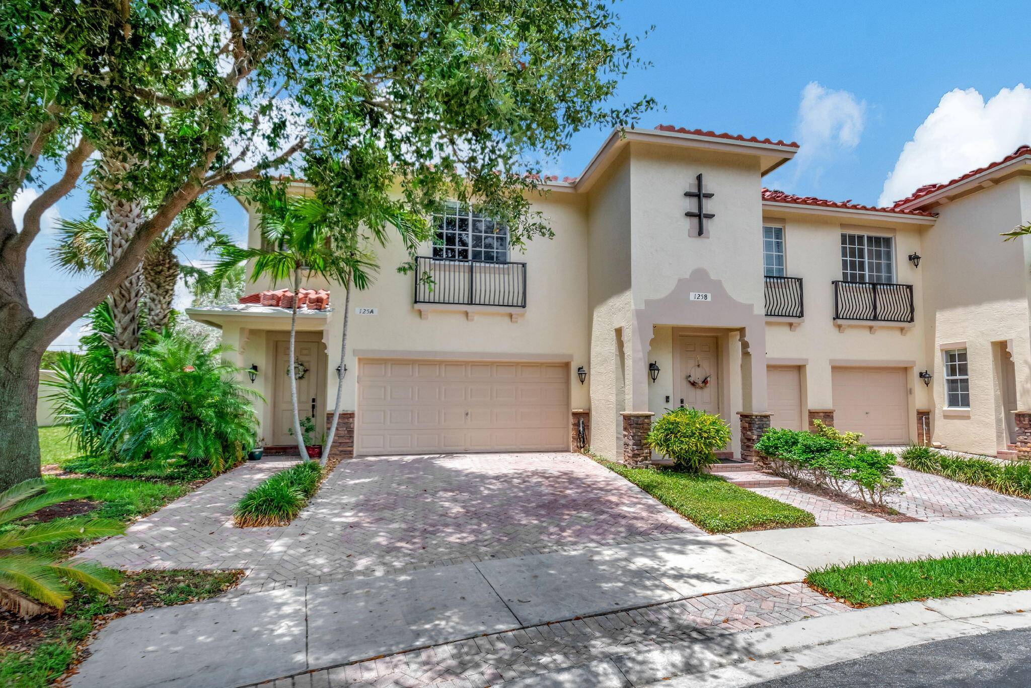 This townhome is tucked away in a private corner is a true gem.
