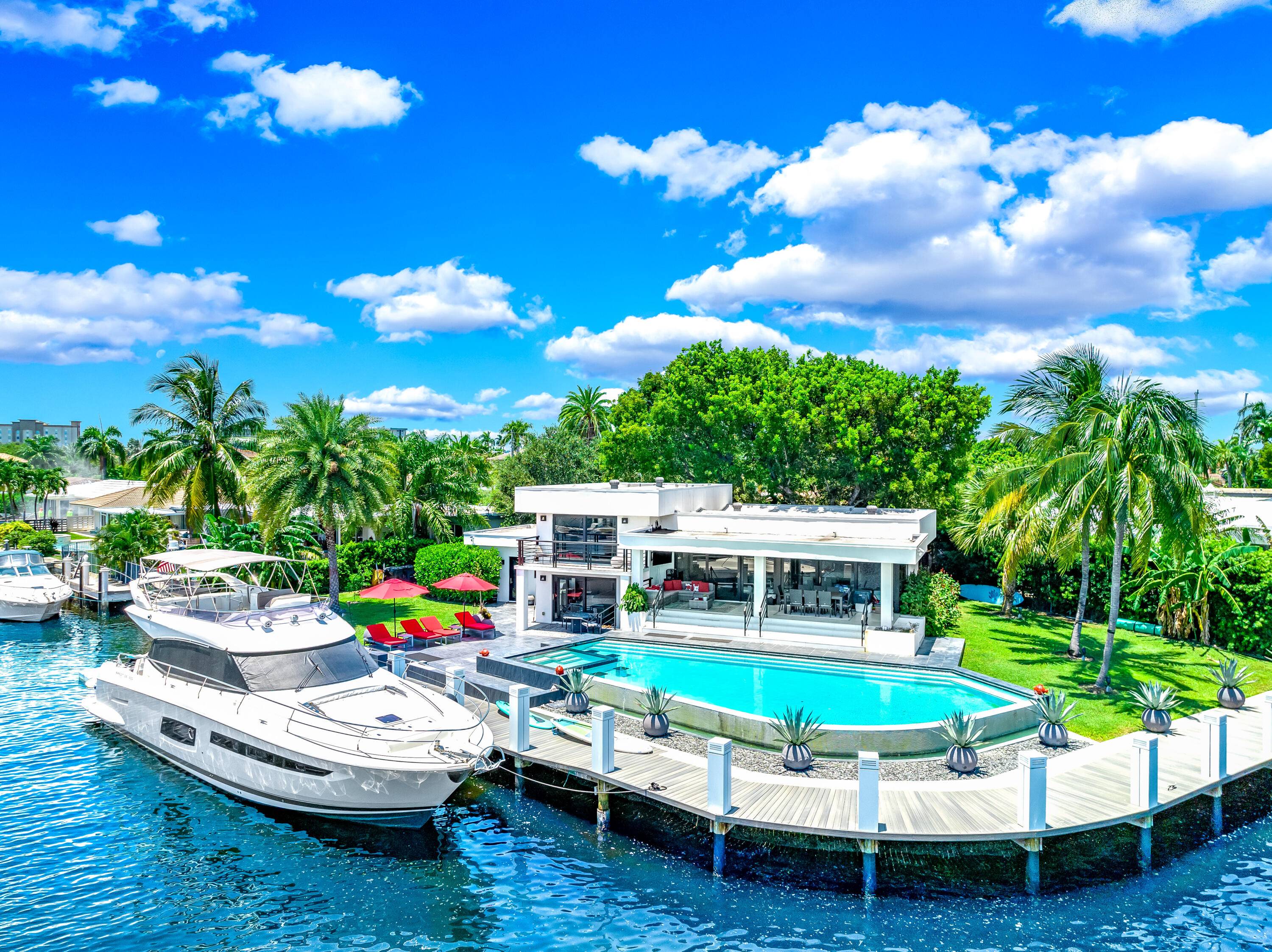 Nestled on a quiet cul de sac with every neighbor on the water, this stunning luxury waterfront home offers unparalleled views of the water and intracoastal.