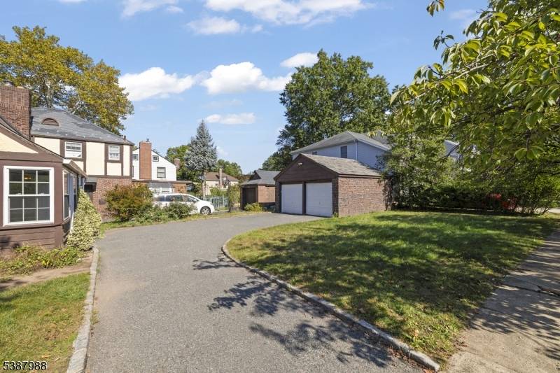 Welcome to this stunning, one of a kind Tudor style home, perfectly positioned on a sought after corner lot at the border of charming Roselle Park.