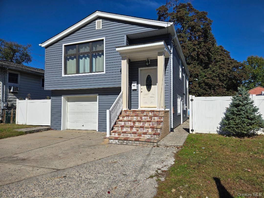 Great large Hi Ranch Mostly Redone, New kitchen with granite Tops, New Appliances, New Roof, New siding, New windows,