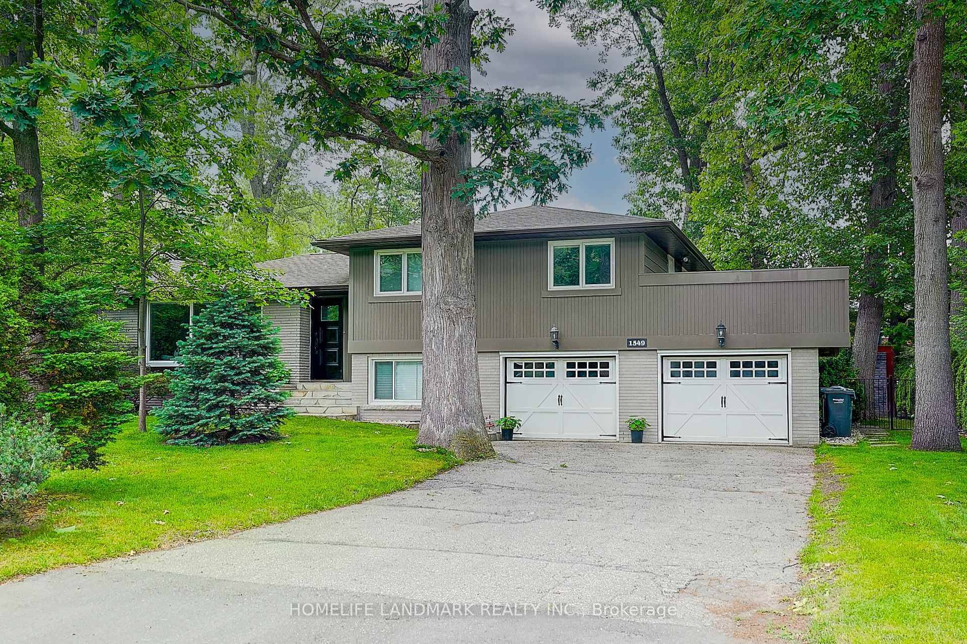 Welcome to 1549 Elite Road in prestigious Lorne Park, Mississauga, forested 100 foot lot offering both privacy and elegance.