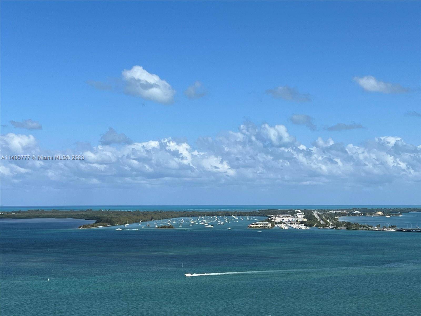 Enjoy unobstructed panoramic Biscayne Bay views from this immaculate SE corner 1 1 Tower Suite Unit at the Emerald at Brickell Condo.