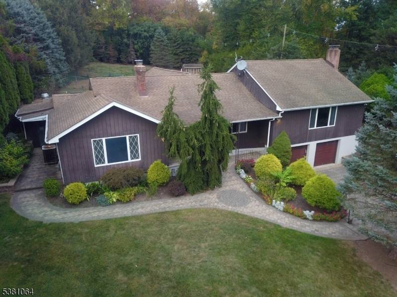 Spectacular expanded East Hanover ranch with a second living quarters.