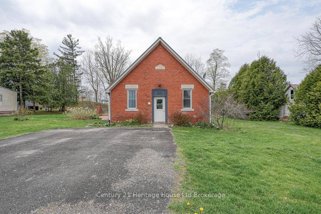 A Half Acre lot nestled along Norfolk County Road 30, this rural home offers a serene countryside setting complimented by thoughtful interior features.