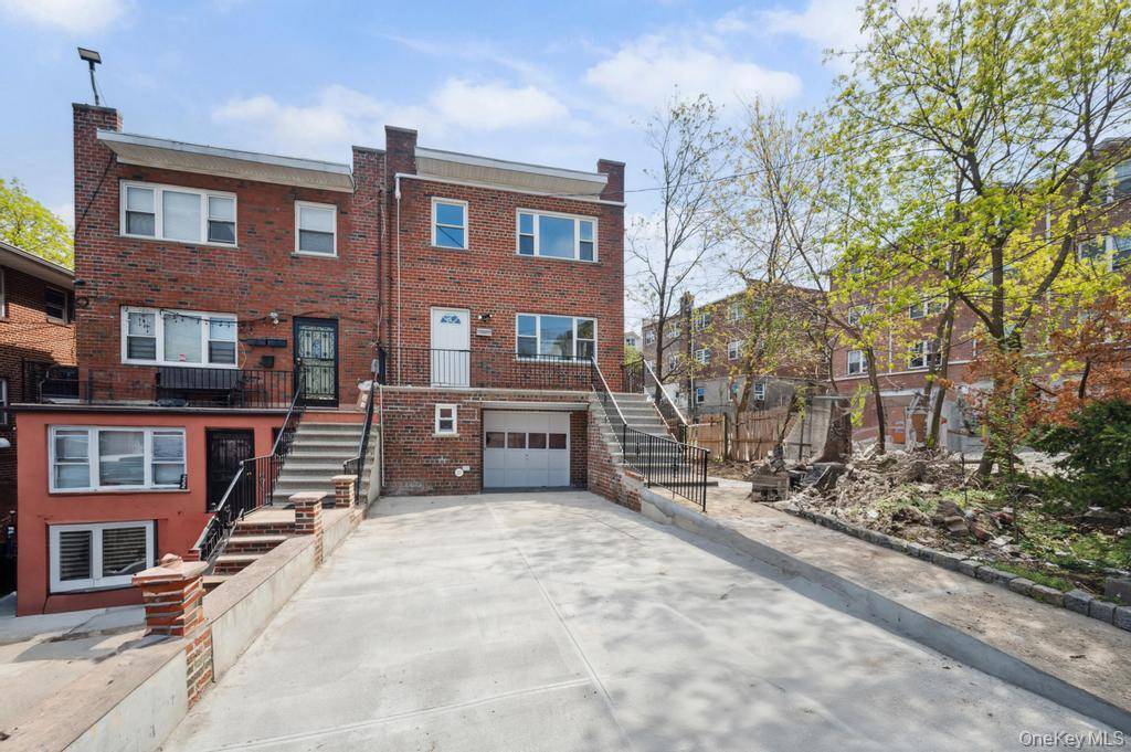 Completely renovated brick semi attached two family home in Riverdale, just one block from Van Cortlandt Park and near the Deegan Expressway I 87.
