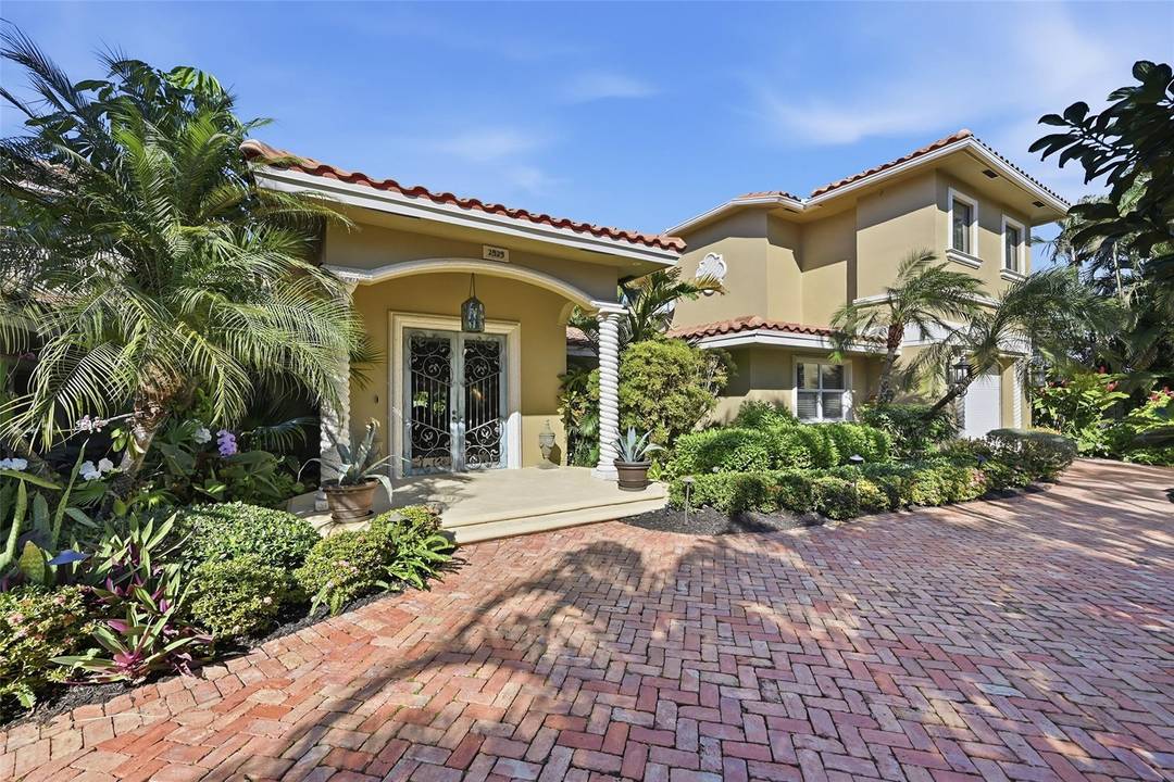 Now offered at a drastically reduced price, this light filled 3BD 3BA Mediterranean inspired estate stands out with timeless style and unique design.