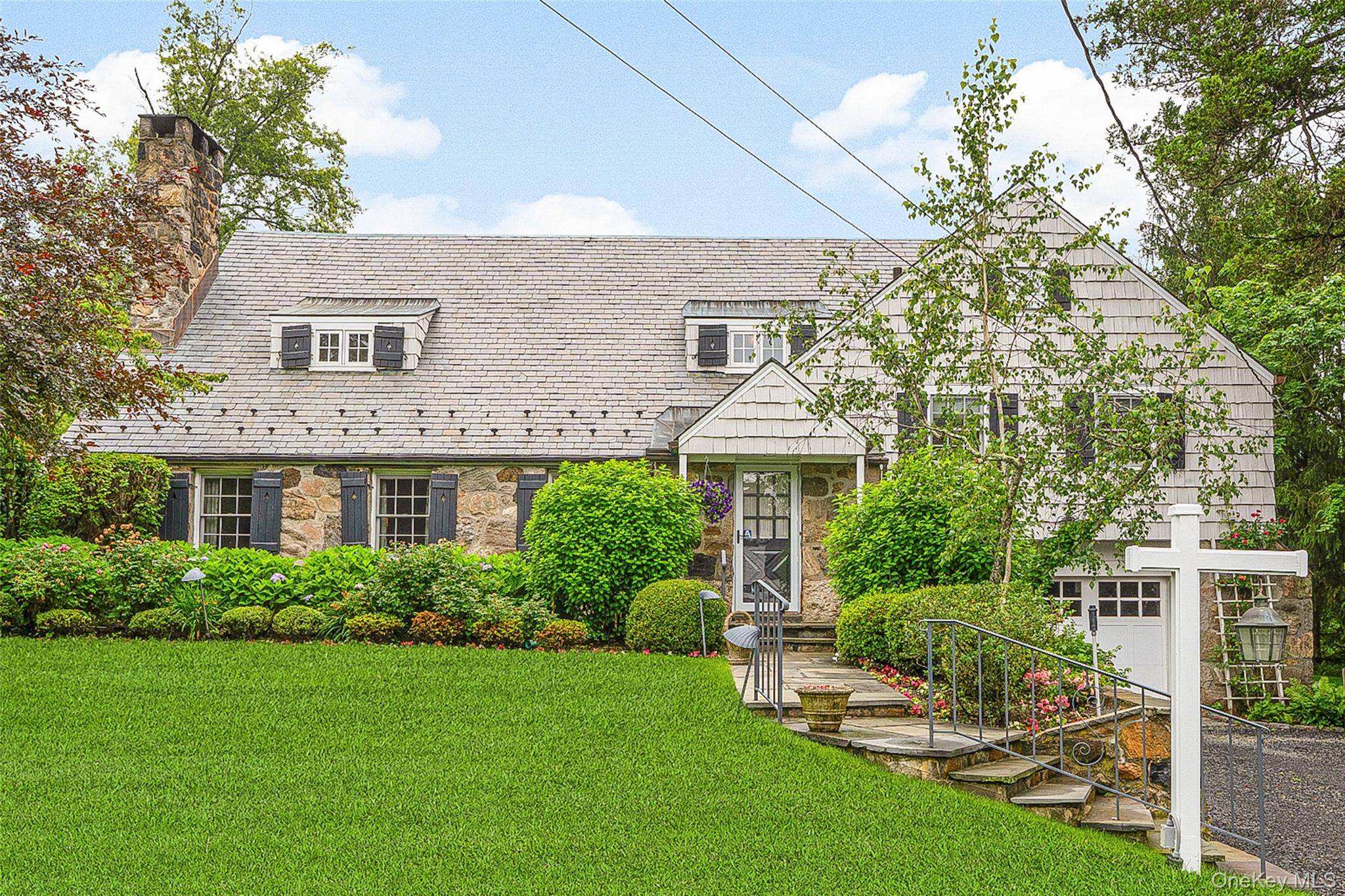 Welcome to 26 Bradford Road an inviting stone front home set on a beautifully landscaped, level 0.
