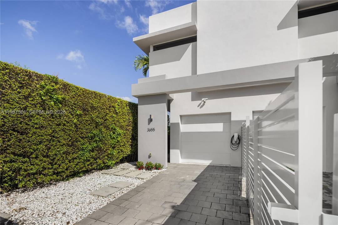 Perfectly positioned townhome in walking distance to the vibrant heart of Coral Gables.