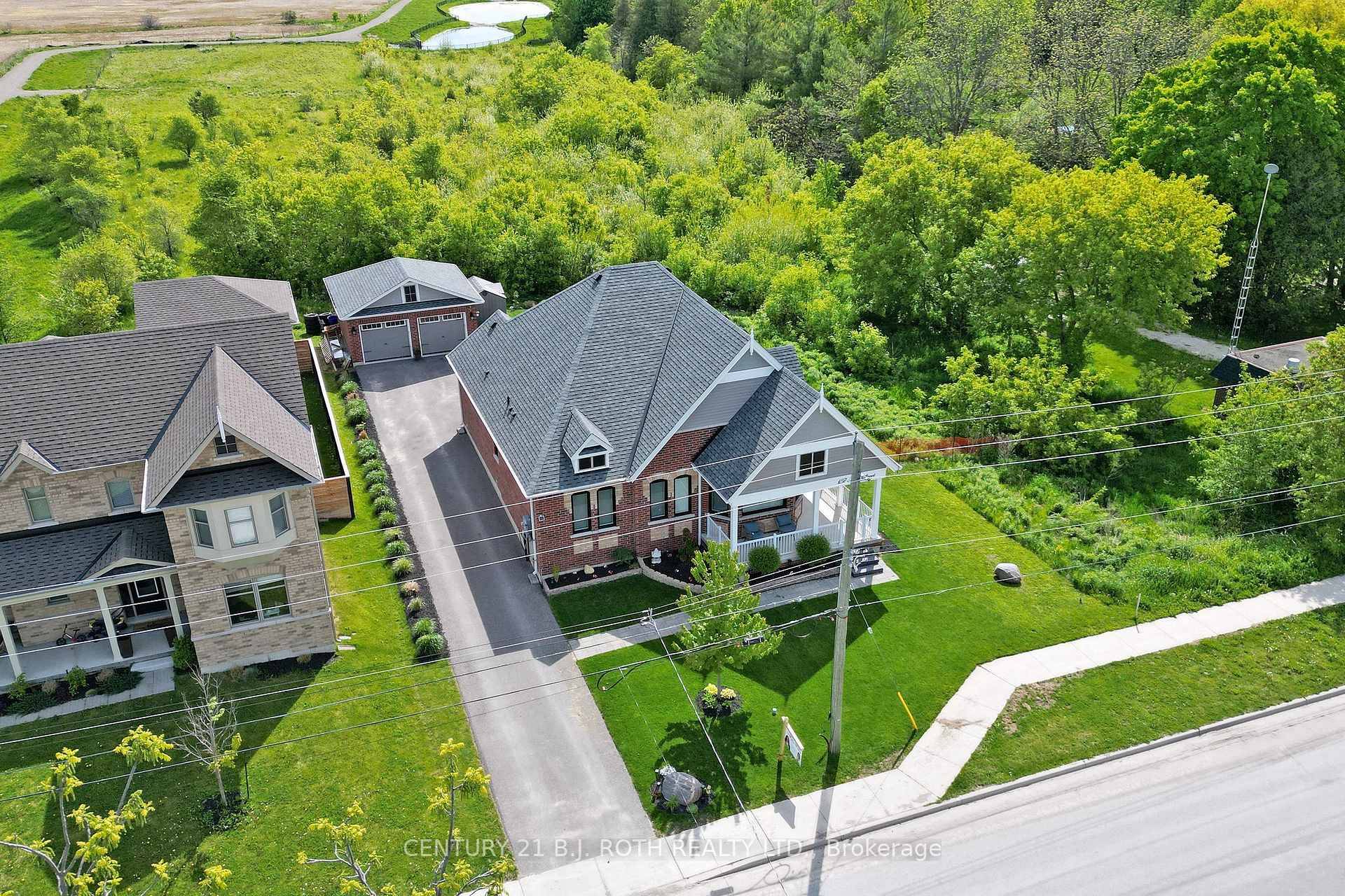 Welcome to 157 Mary St., Creemore a charming all brick bungalow situated on a private corner lot, backing onto serene open fields with no side neighbors.