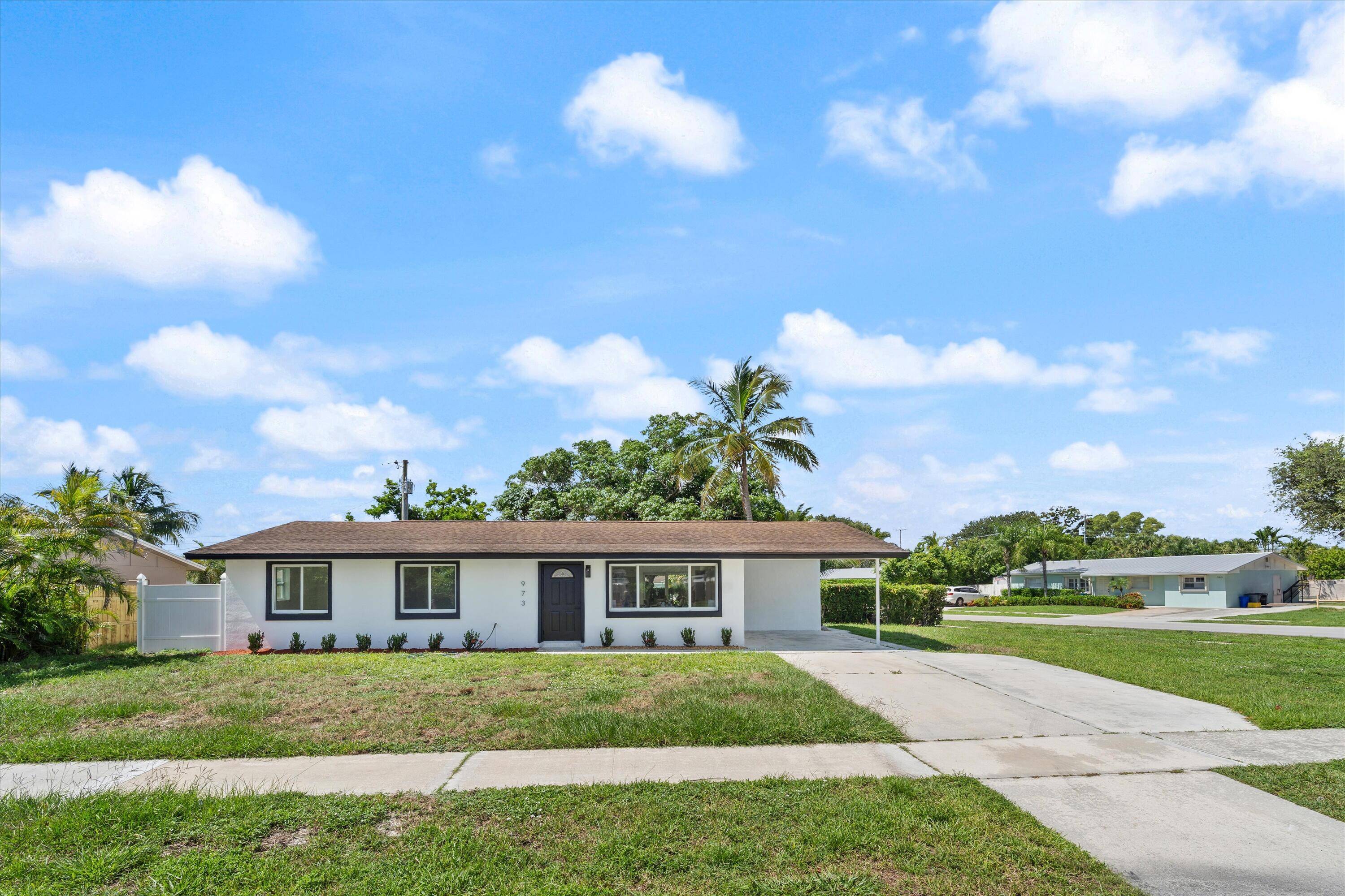 BRAND NEW INSIDE. Stunning remodel on this classic style home in the heart of North Palm Beach.