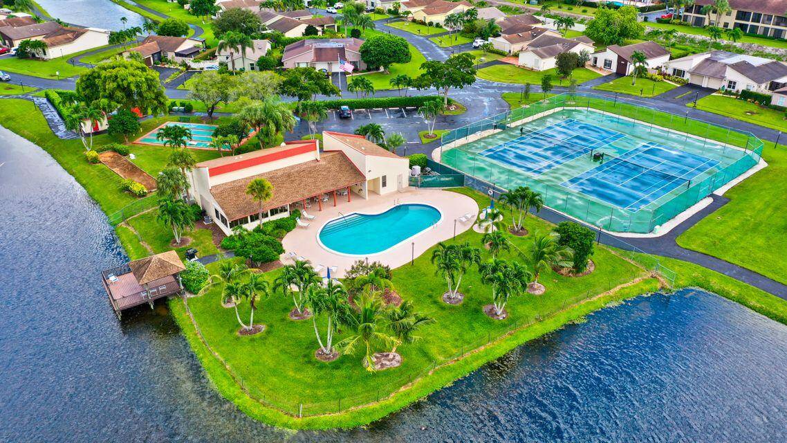 Priced to SELL ! Waterfront 2BR 2BA home w garage lovely impact glass enclosed Florida room.