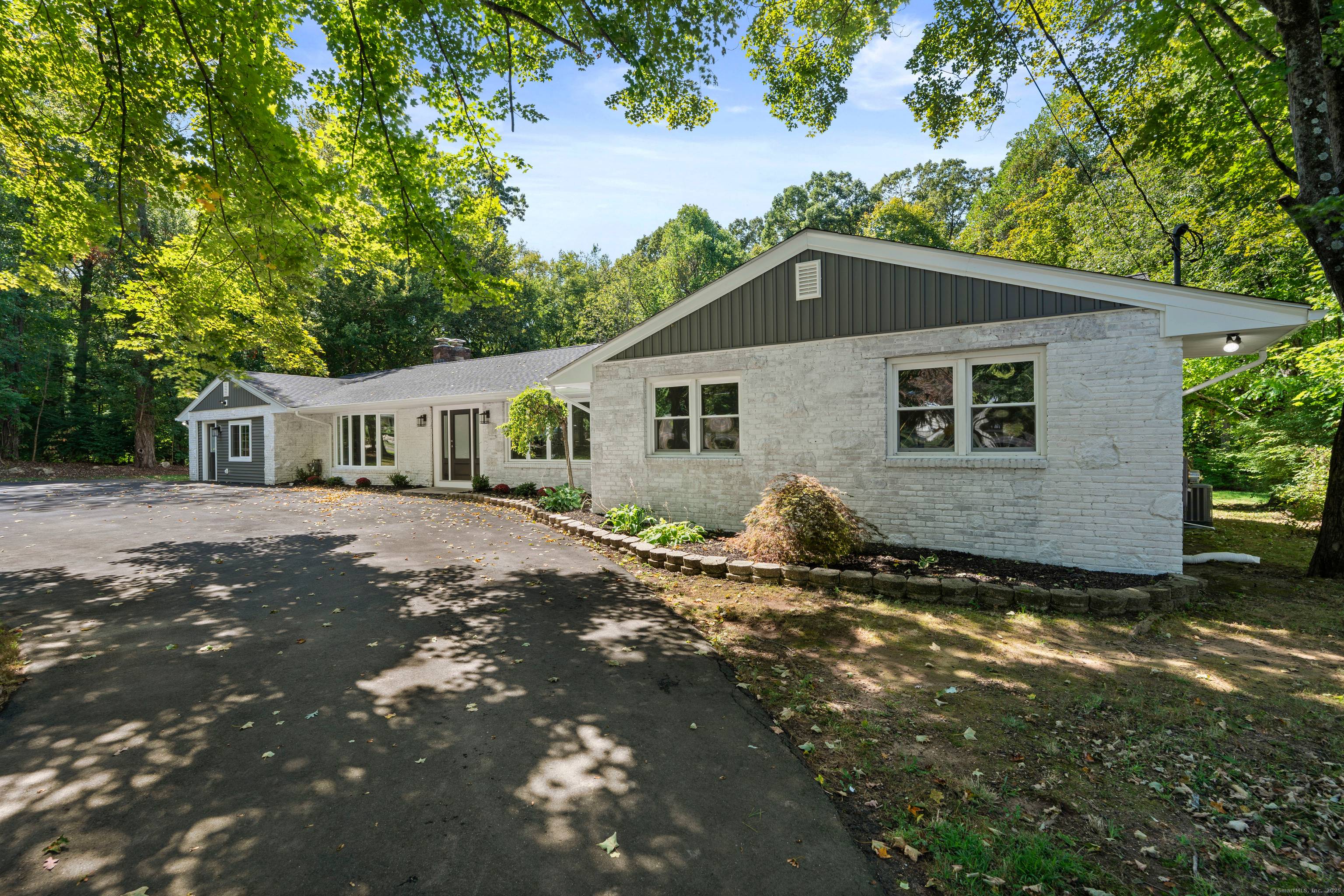 Welcome to 21 Featherbed Lane a beautifully renovated 5 BR, 4 bath ranch south of route 1 in Branford.