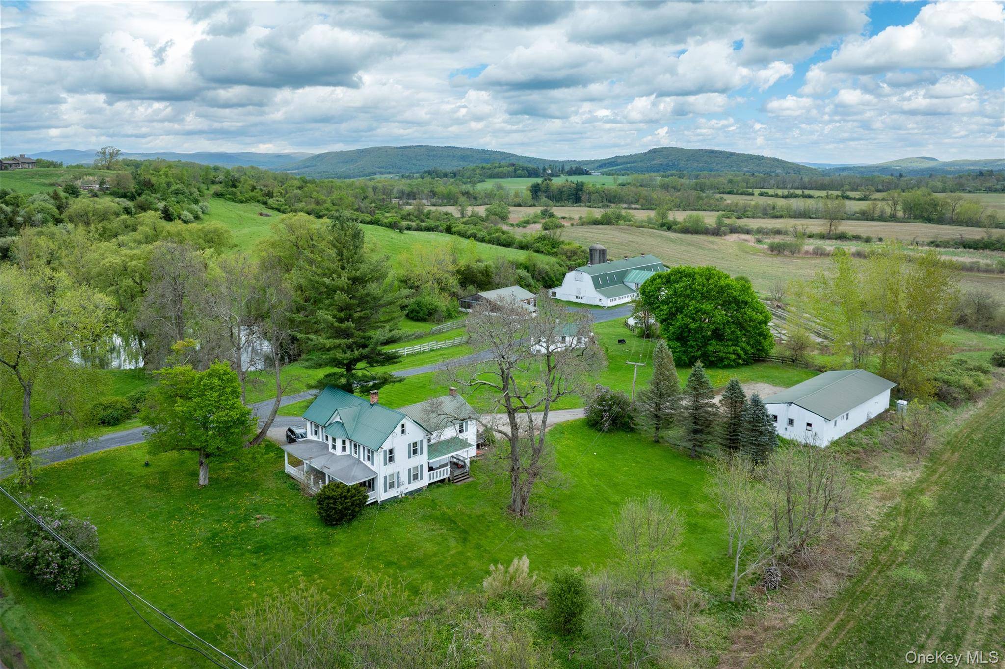 Discover a rare opportunity to own a remarkable 127 acre residential farm that straddles the charming towns of North East and Amenia in New York's picturesque Hudson Valley.