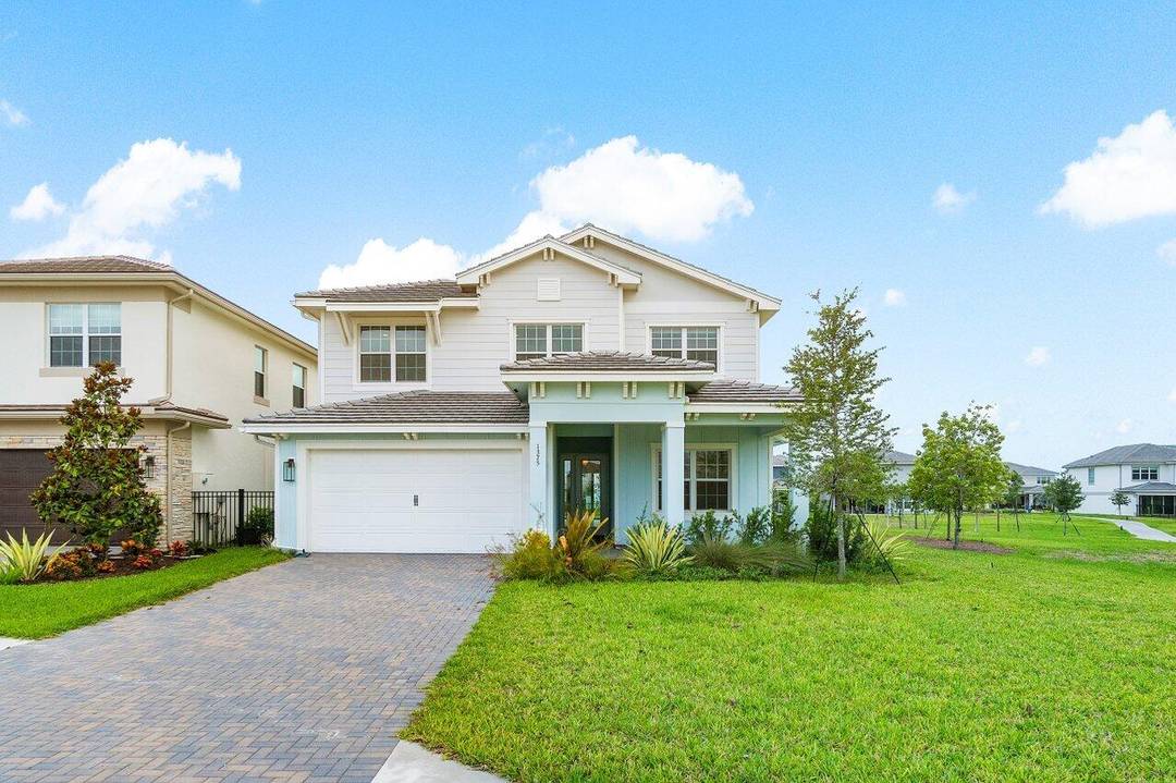 Welcome to your dream rental home in the vibrant Agrihood community of Arden, located in the picturesque area of Loxahatchee.