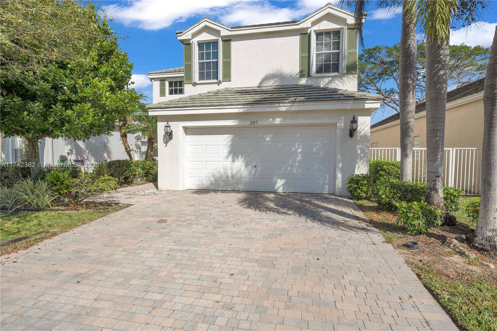 Welcome to this stunning 5 bedroom, 3 bathroom lakefront home in a premier gated community in Lake Worth Royal Palm Beach.