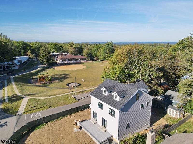 This NEW CONSTRUCTION Colonial is 4 beds 4 full bath and 1 half bath to be completed by November 2025.