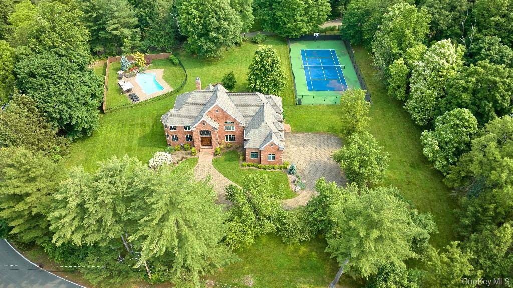 Custom designed 6, 897 sf all brick home in impecable conditions and located on private two acre with large, flat lawn areas, sports court, heated, salt water concrete in ground ...