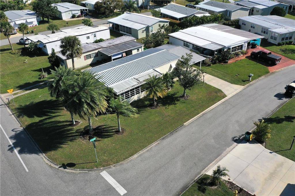 Prime corner lot in the heart of Barefoot Bay within easy walking distance to the bank, golf course, restaurant.