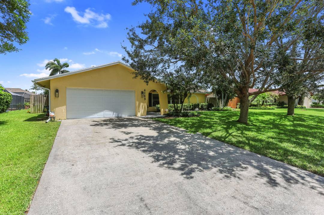 Welcome to this beautifully maintained single story residence offering four spacious bedrooms and two full bathrooms, perfectly situated in the heart of Palm Beach Gardens.