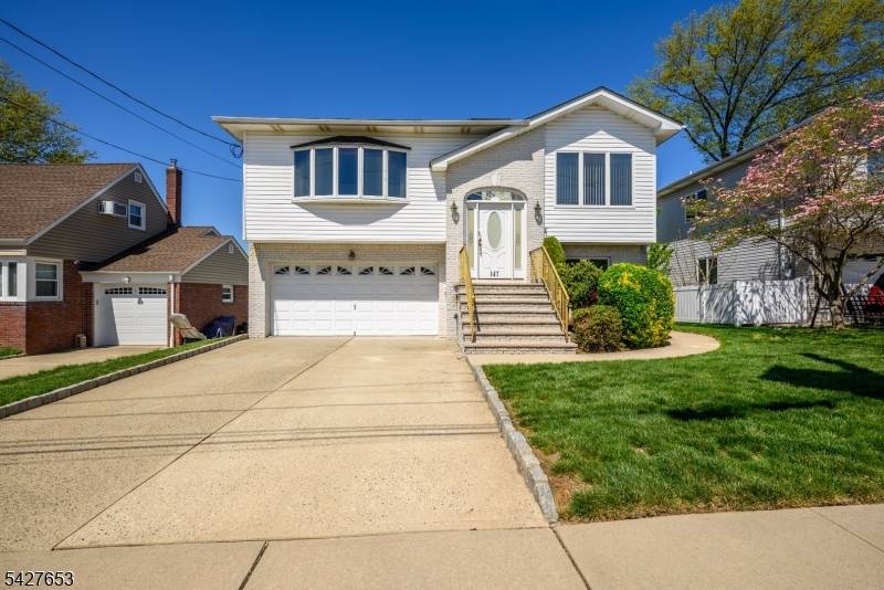 Welcome to 147 11th Street, a well appointed bi level home nestled in the heart of Wood Ridge, NJ.
