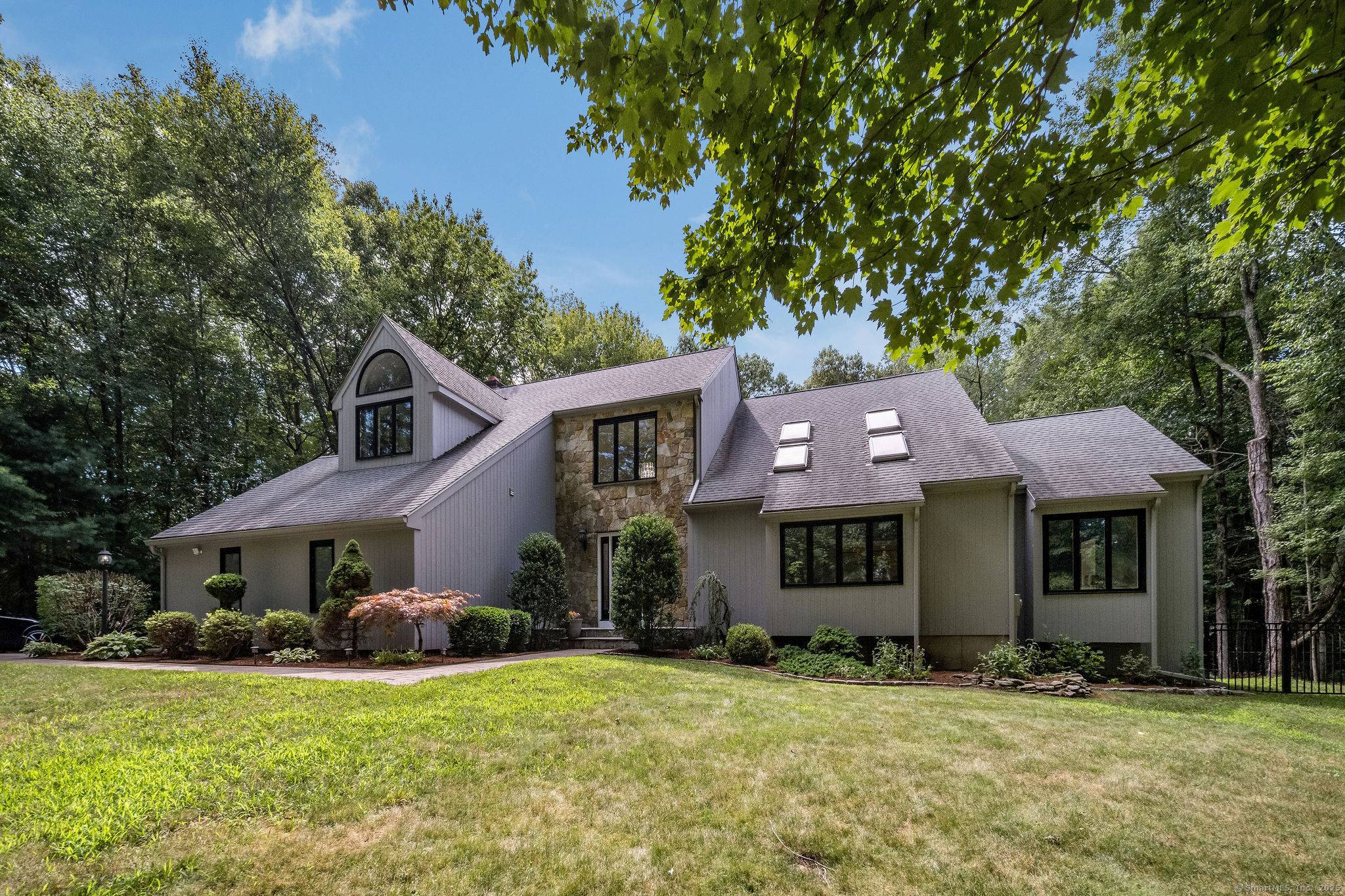 Tucked away on 1. 88 acres of level land in one of the area's most beautiful neighborhoods, this 4 bedroom contemporary colonial offers the perfect blend of privacy.