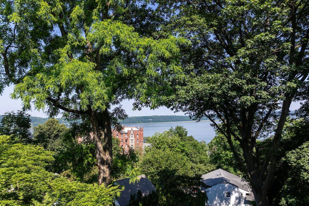 Outstanding year round Hudson River views await in this unique and newly renovated 2 bedroom 2 bath condominium just two blocks from downtown Dobbs Ferry.