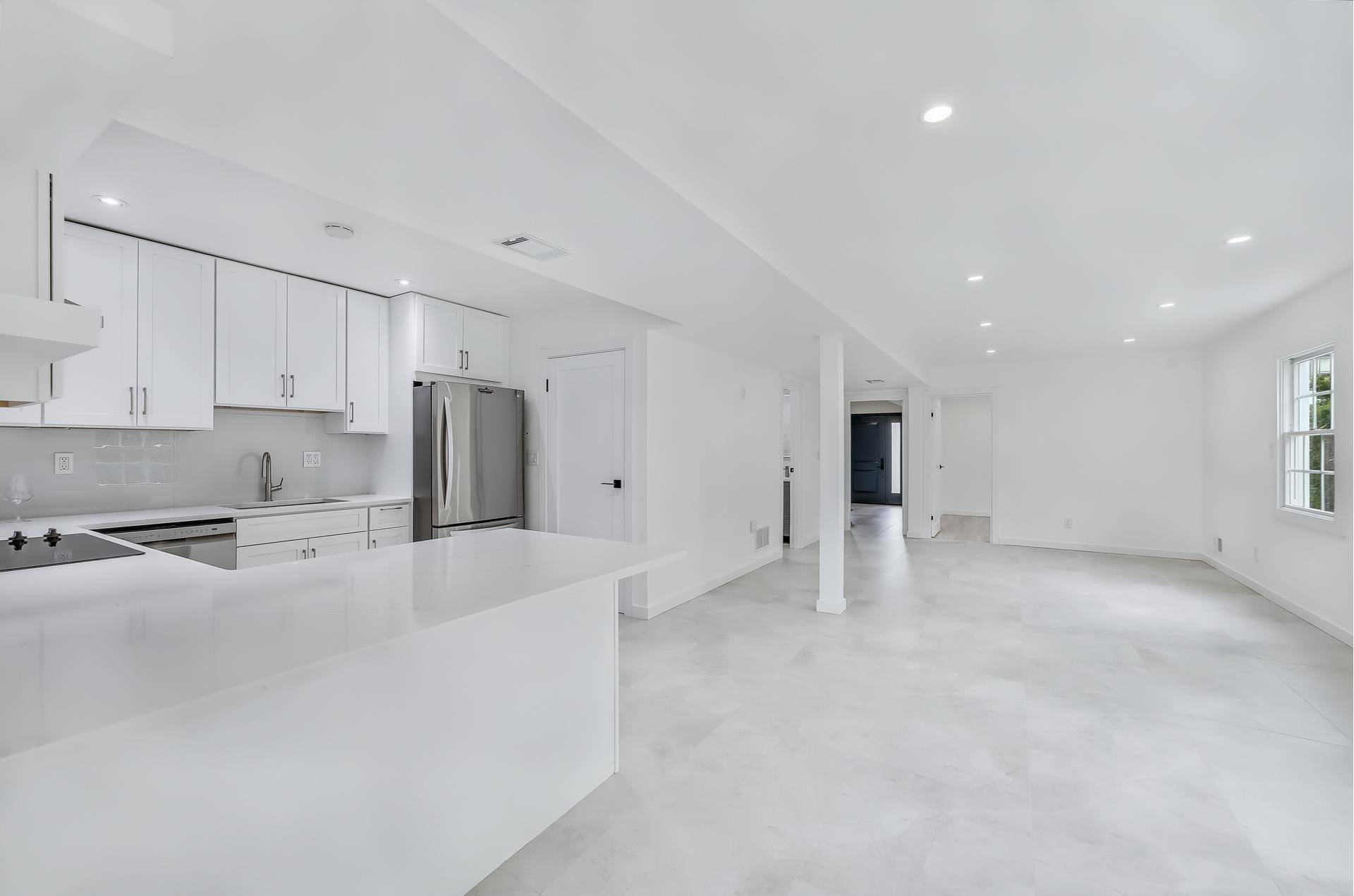 Welcome to a beautifully reimagined home in Brooklyn's exclusive, gated Seagate community.