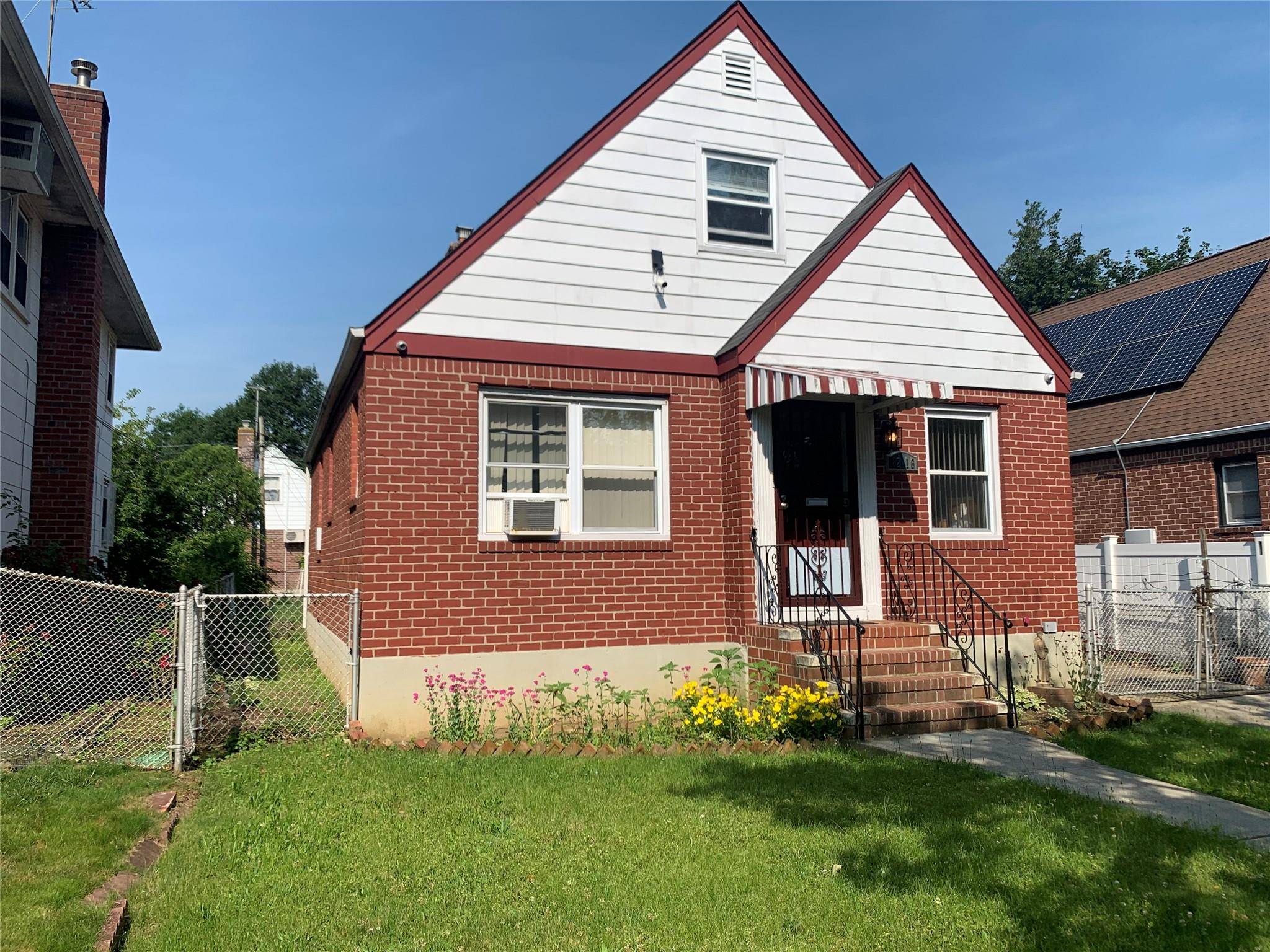 Beautifully maintained full brick Cape style home with a detached garage and private driveway.