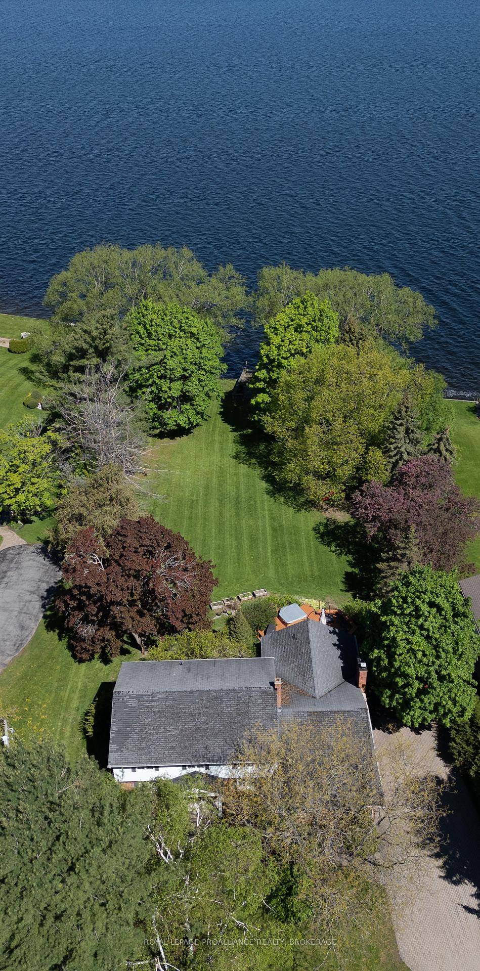 Embrace serenity by the shore in this remarkable 4 bedroom, 2.