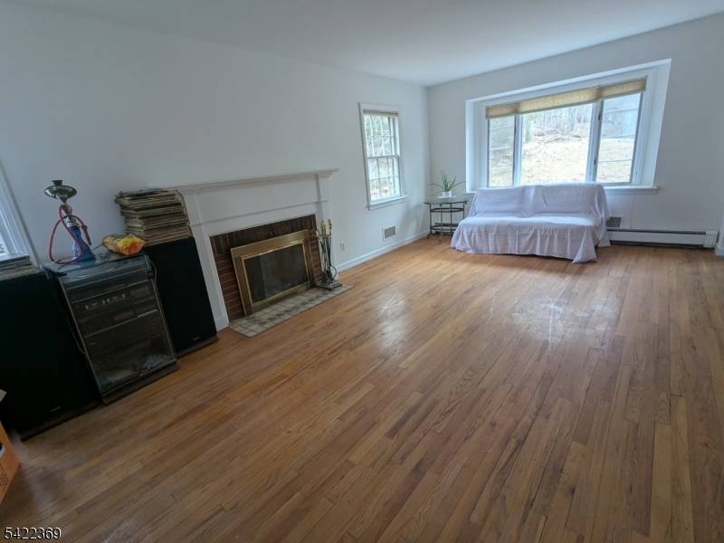 Welcome to 18 Mountainside Dr in the highly desirable Packanack Lake community of Wayne !