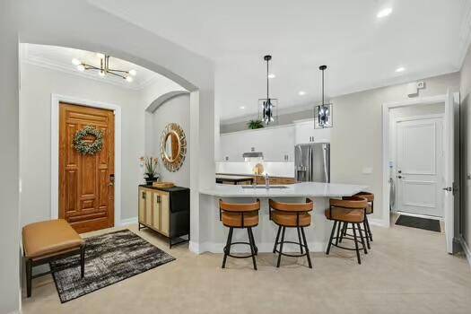 Spectacular RENOVATED SINGLE STORY plan featuring a most welcoming open layout that accommodates up to 7 guests in the highly sought after Frenchman's Reserve Country Club.