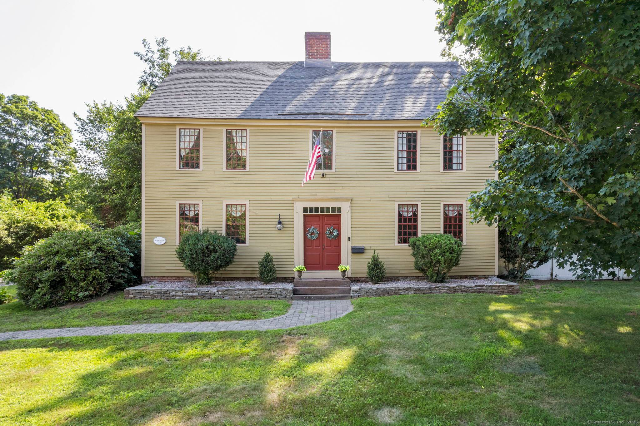 Step into a timeless piece of New England history with the Jehiel Hale House, a distinguished 1795 Colonial, gracefully sited on Glastonbury's coveted Main Street.