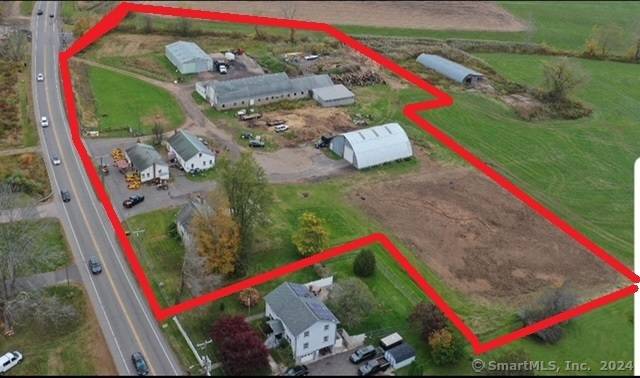 2 Residential and several commercial outbuildings on 4.