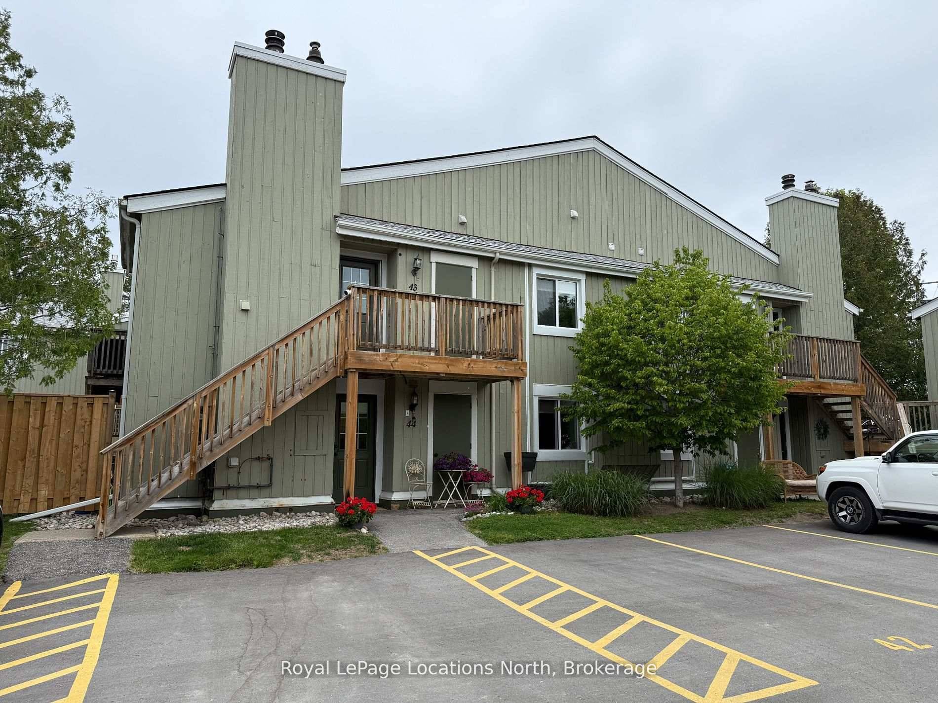 Pretty condo with open concept kitchen living dining area with woodburning fireplace amp ; walkout to deck in the popular Living Water development.