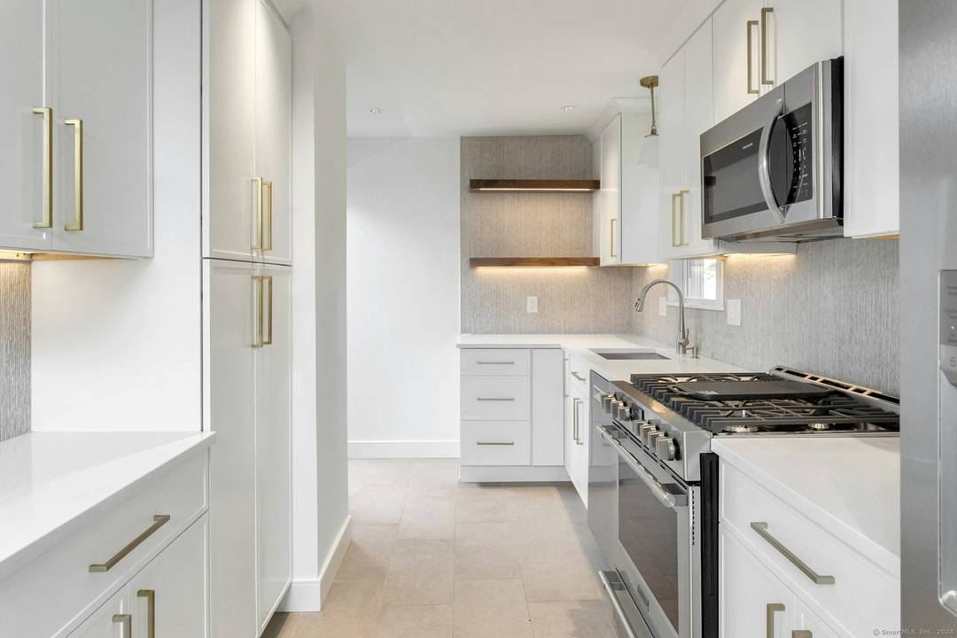 North End 4 5BR 2BA Cape set on a quiet cul de sac offering a flexible layout and beautifully updated interiors.