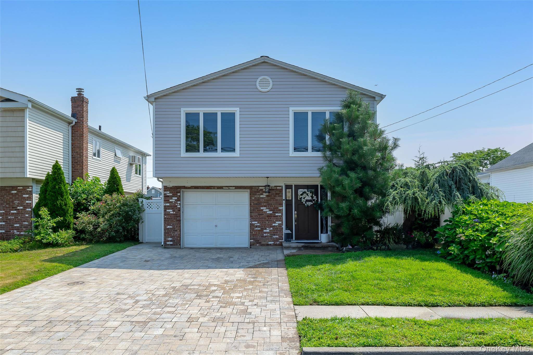 Welcome to this beautifully updated Hi Ranch in Babylon Village, located in the West Babylon School District.
