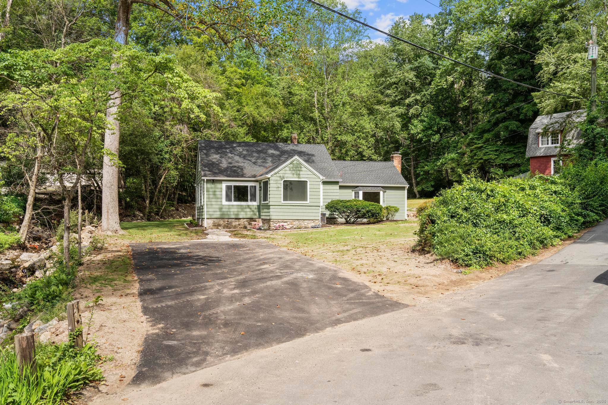 Step into modern comfort and timeless charm with this completely renovated home, perfectly nestled in a serene and quiet corner of Sandy Hook.