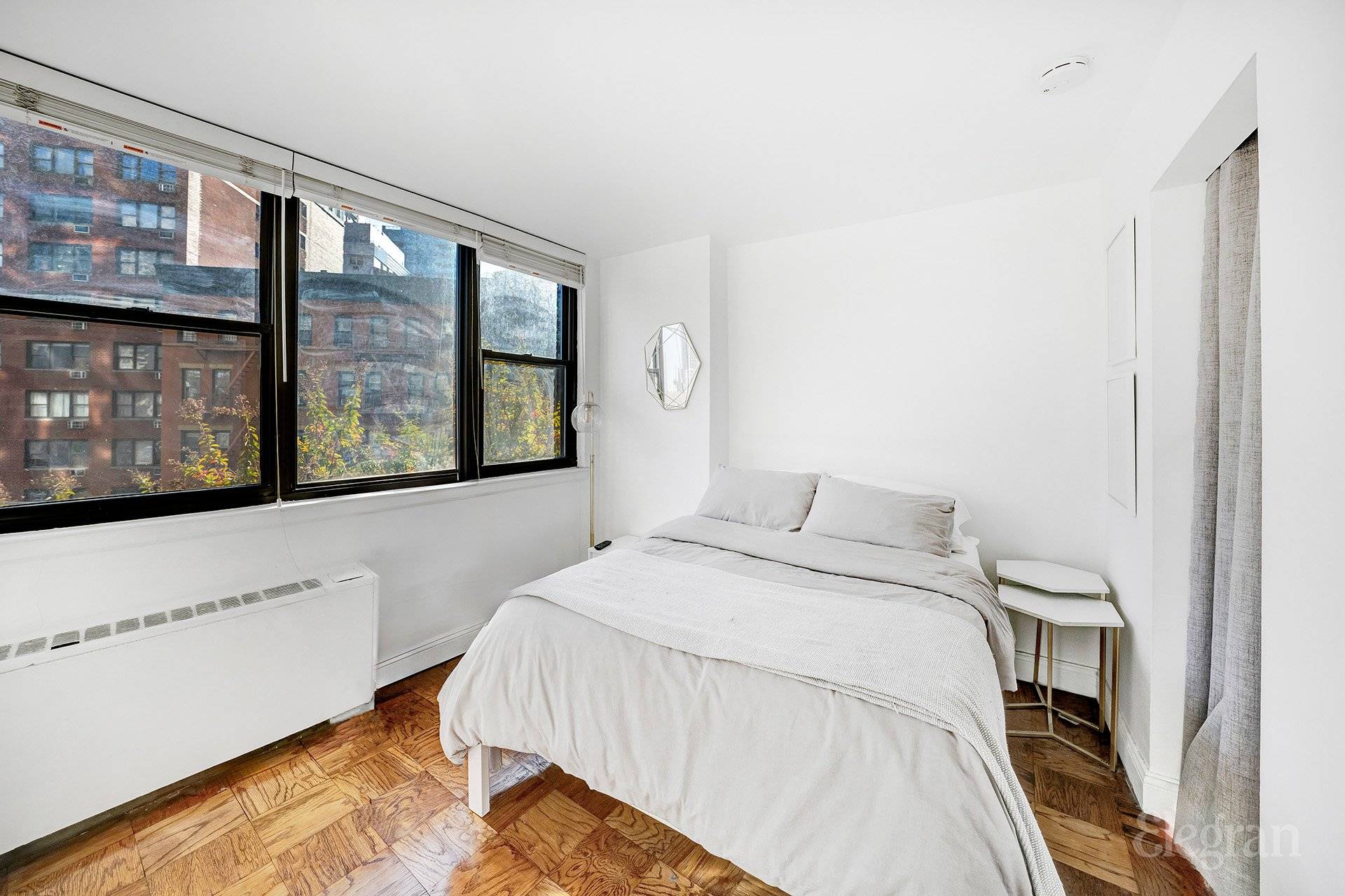 South Facing Sunny, Renovated Alcove Studio in the full service Murray Hill Crescent Enjoy natural light and open skyline views to the South.
