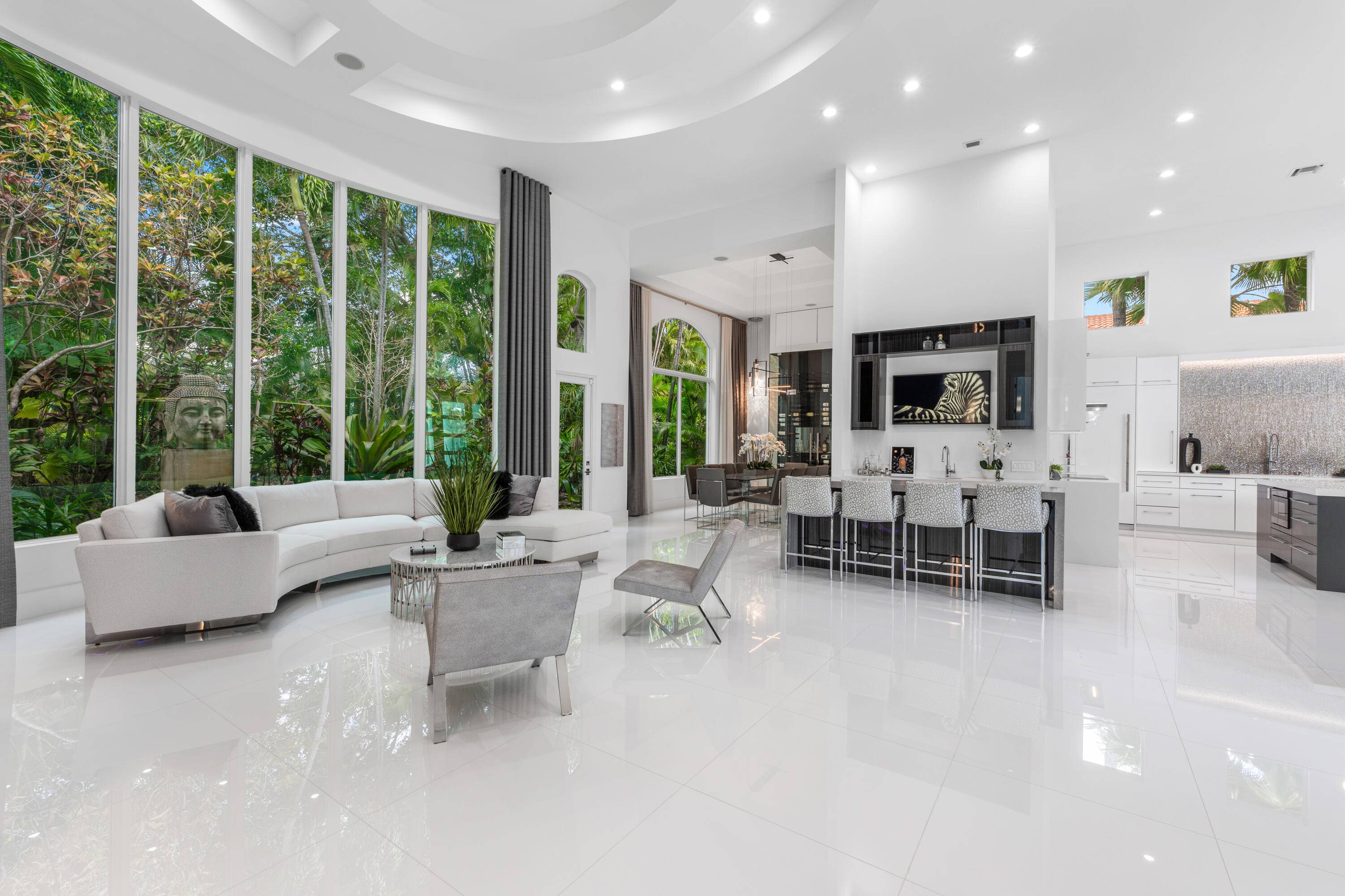 Welcome to a masterfully renovated estate in the prestigious Polo Club, where timeless elegance meets modern sophistication.