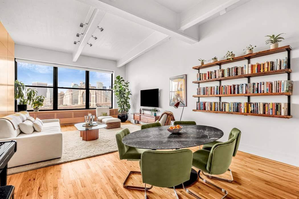 Enjoy breathtaking views of the Brooklyn Bridge, Brooklyn Bridge Park, East River, and the New York City Skyline, all perfectly framed by oversized windows in this truly iconic DUMBO loft.