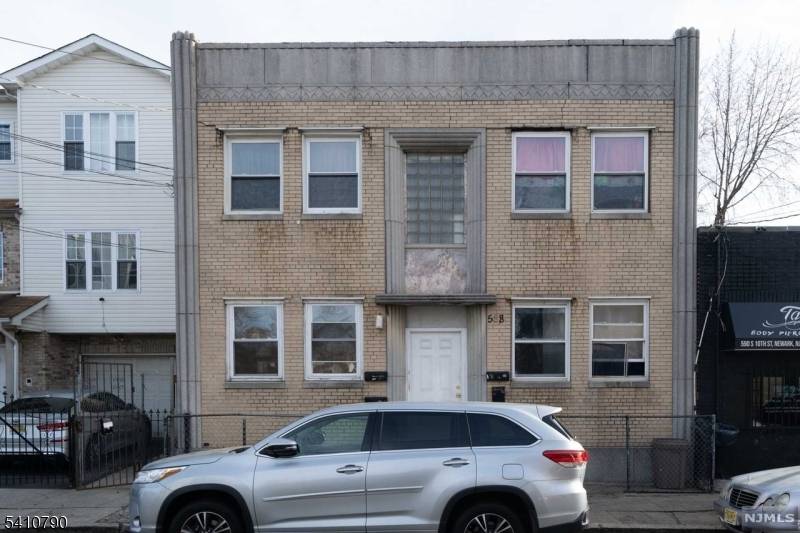 Welcome to this solid brick 4 unit home, offering a rare opportunity to live comfortably while earning rental income.