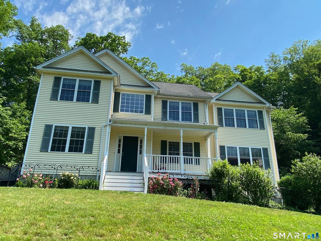This sun filled, freshly painted Colonial offers a tranquil setting on a picturesque lot, surrounded by flower gardens, fruit trees, and natural scenery.