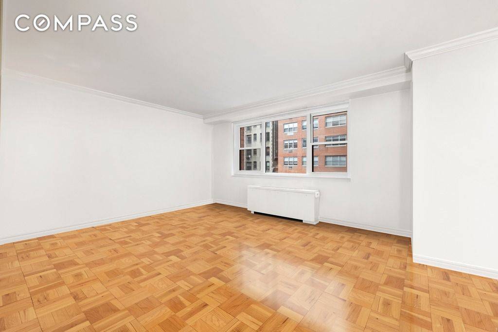 A charming alcove studio on a prime block between Park and Lexington Avenues !